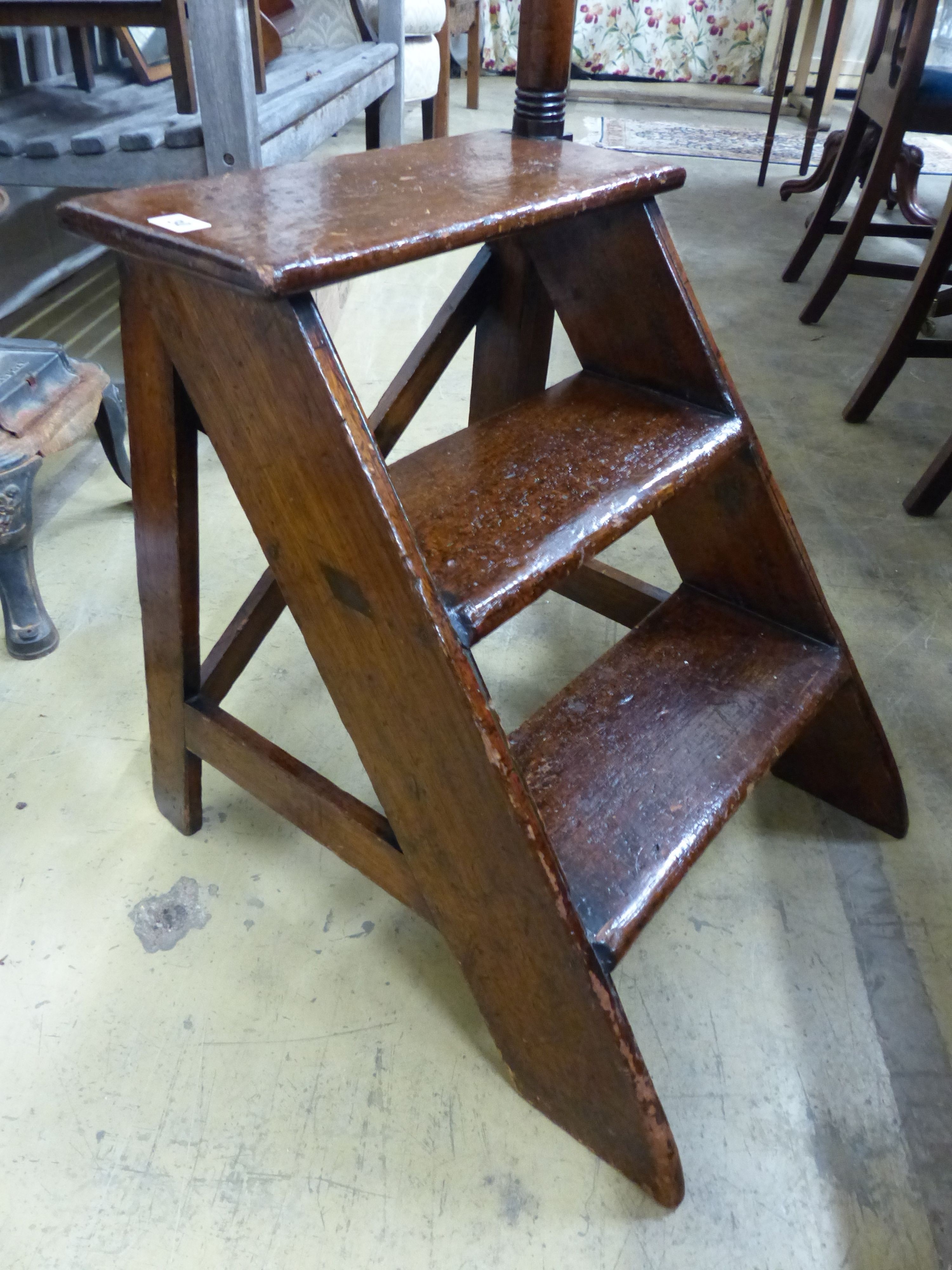 A set of early 19th century mahogany and pine three tread library steps with turned hand rail, W.45cm H.170cm